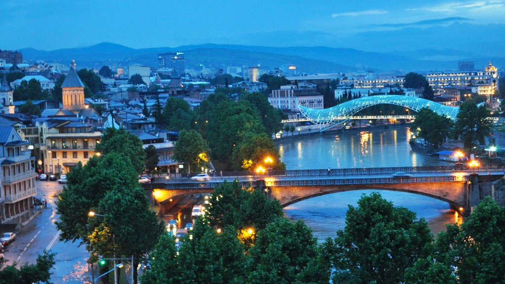 Tbilisi pedestrian glass Bridge of Peace and River Mtkvari